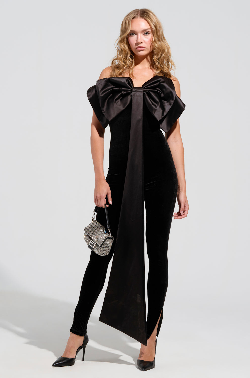 I'M THE GIFT VELVET JUMPSUIT WITH A BOW – AKIRA