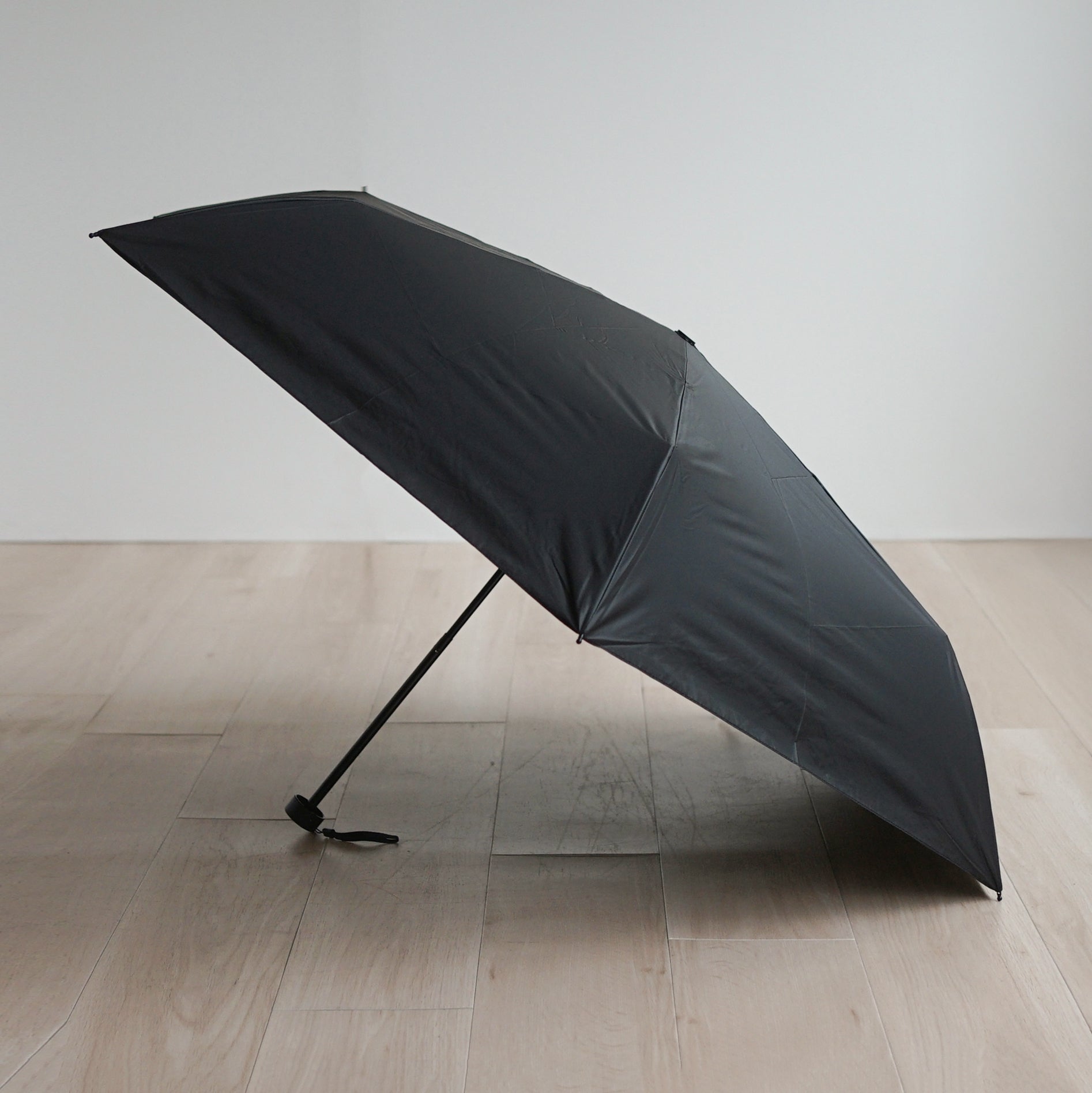 A large foldable umbrella for men, suitable for both rain and