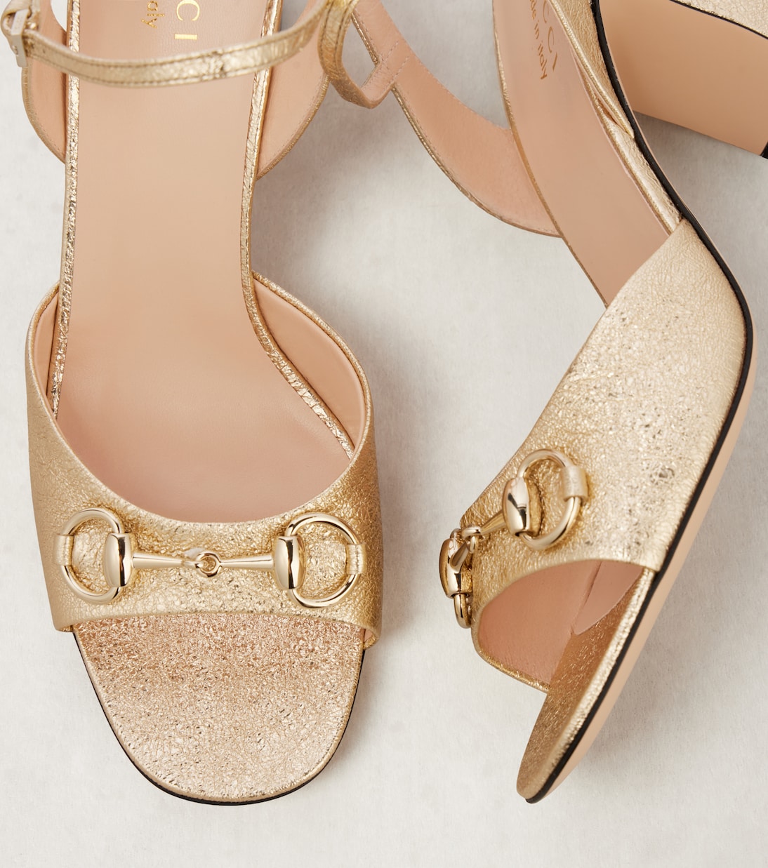 Horsebit metallic leather sandals in gold - Gucci | Mytheresa
