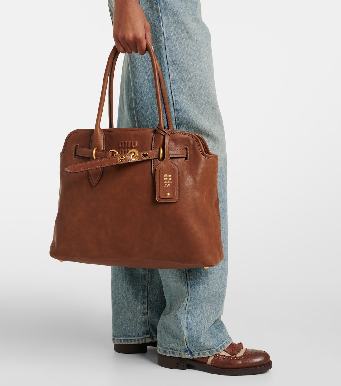 Aventure Medium leather tote bag in brown - Miu Miu | Mytheresa