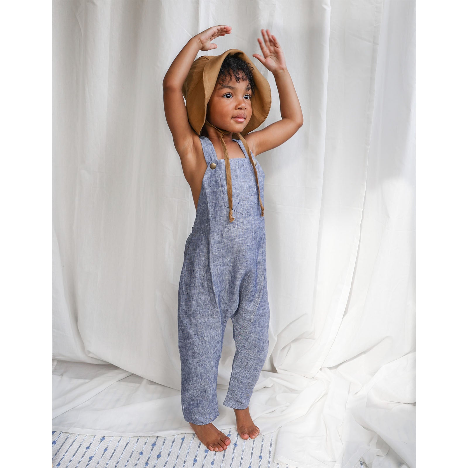 Expandable grow-with-me blue linen baby & toddler harem romper