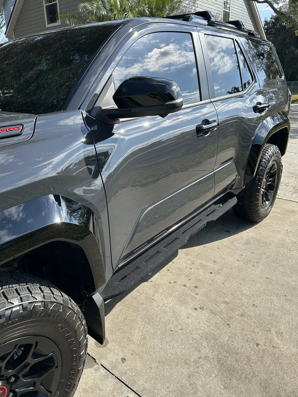 OEM TRD black cast aluminum running boards installed on TRD Pro