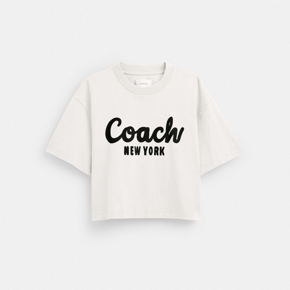 公式】COACH – コーチ | カーシヴ シグネチャー クロップド Tシャツ