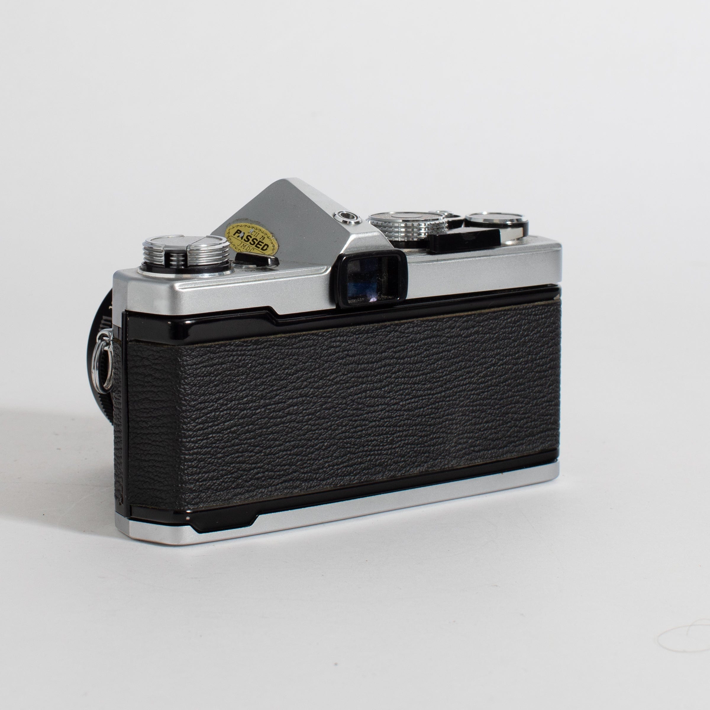 Olympus OM-1 with 50mm f/1.4 lens and leather case (film tested