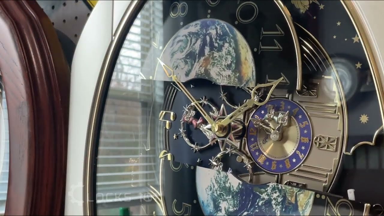 DWS Peaceful Cosmos (4MH751AR19) Small World Rhythm Clock - YouTube