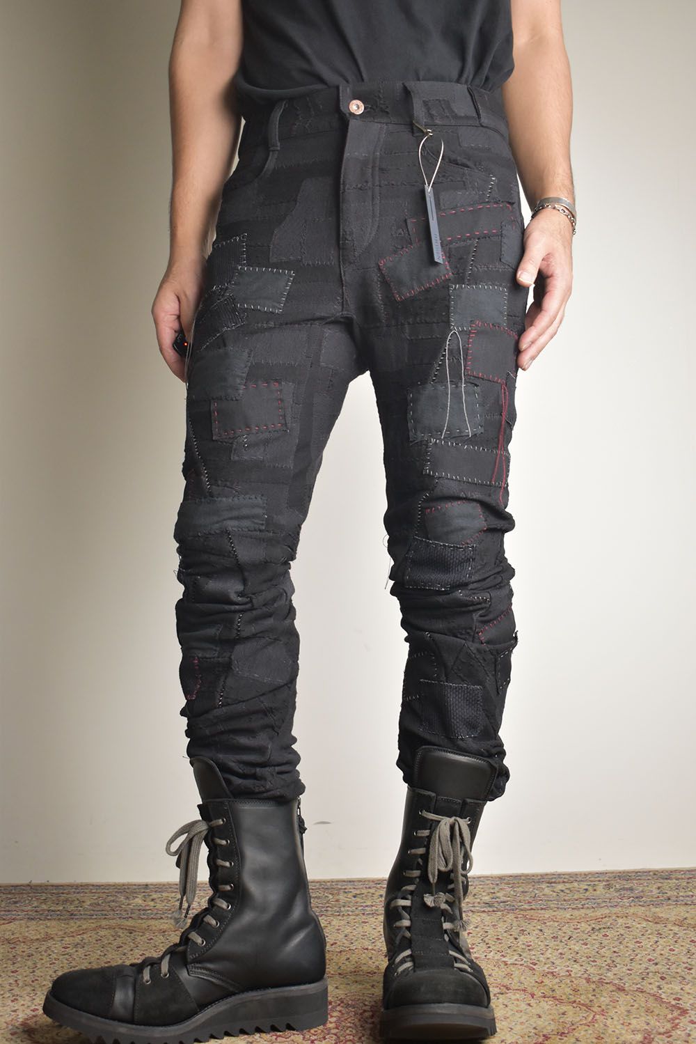 D.HYGEN - Hand Patchwork Crust Jacquard Overlock Twist Curve Pants