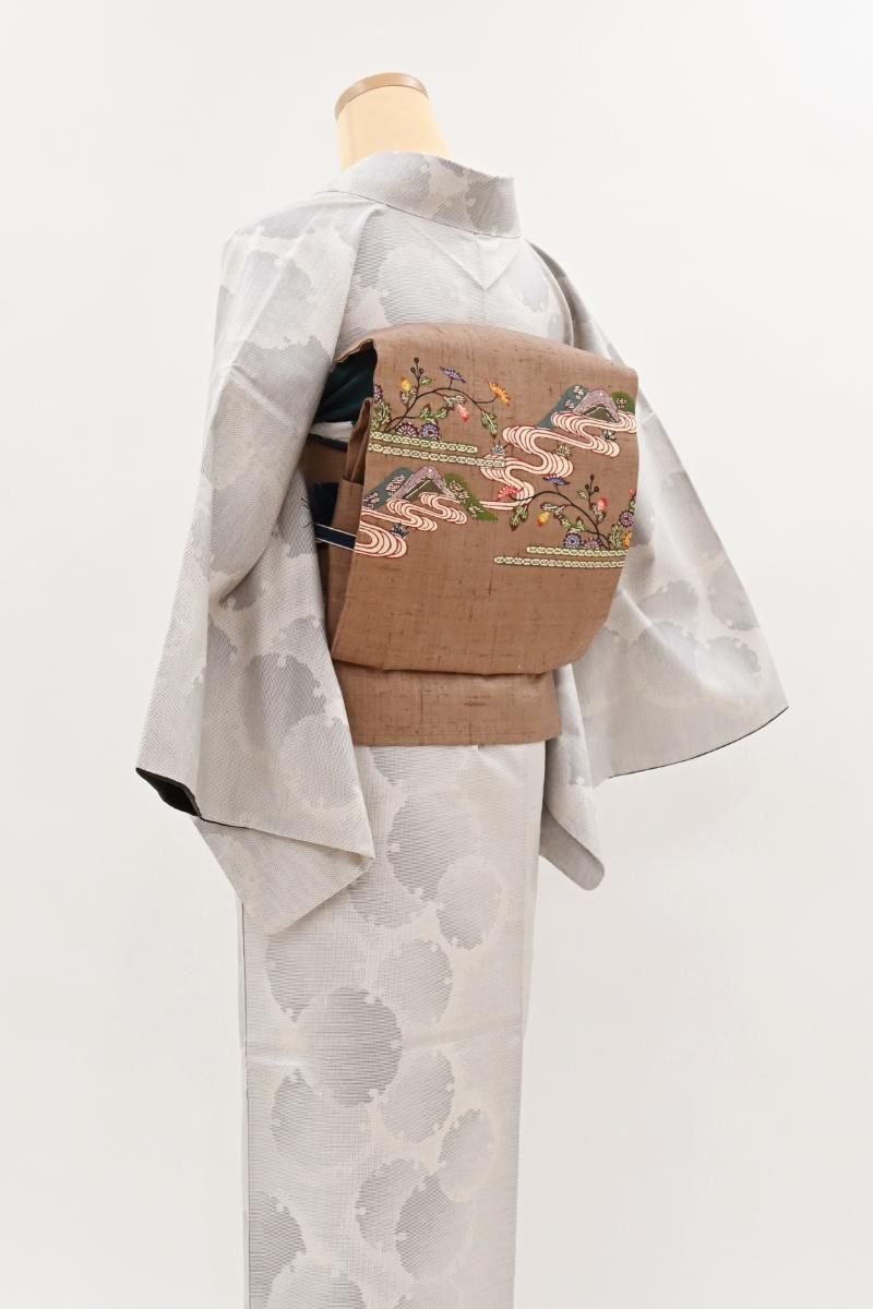 銀座【H-0742】紬地 紅型 染名古屋帯 橡色 花に風景文 - 銀座きもの