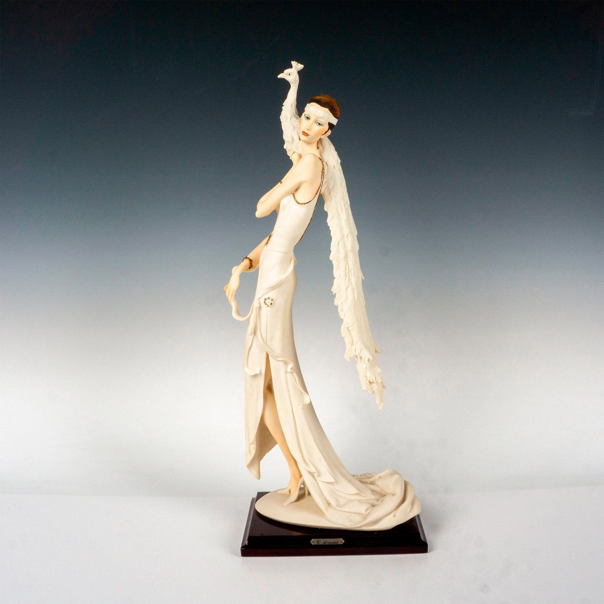 Florence Giuseppe Armani Figurine, Lady with Peacock sold at