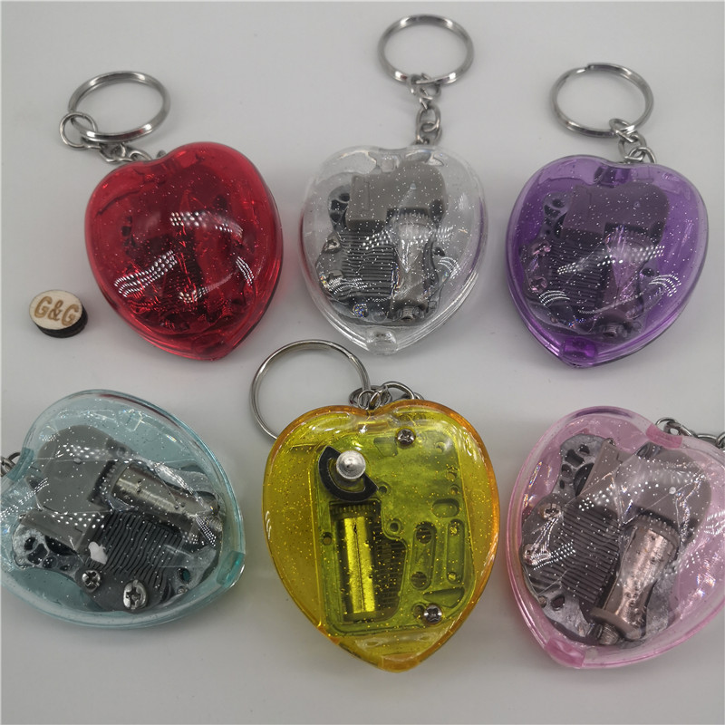 工場カラフルなワインドアップオルゴールキーホルダークリアアクリル
