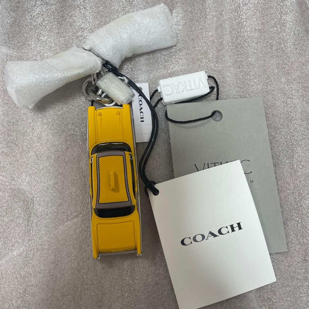 最終値下げ COACH スモール タクシー バッグ チャーム イエローキャブ
