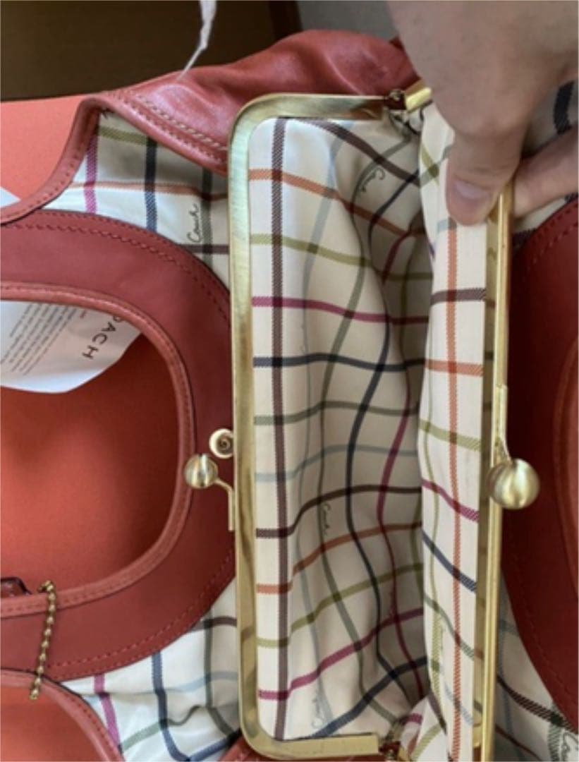 コーチ オレンジ エルゴレザープリーテッドフレームドサッチェル